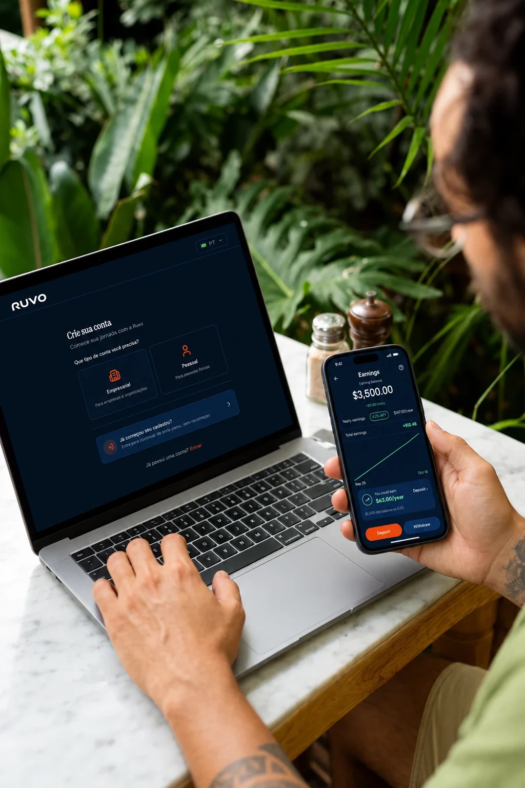 Someone checking the Ruvo app on their phone, with Ruvo open on the laptop